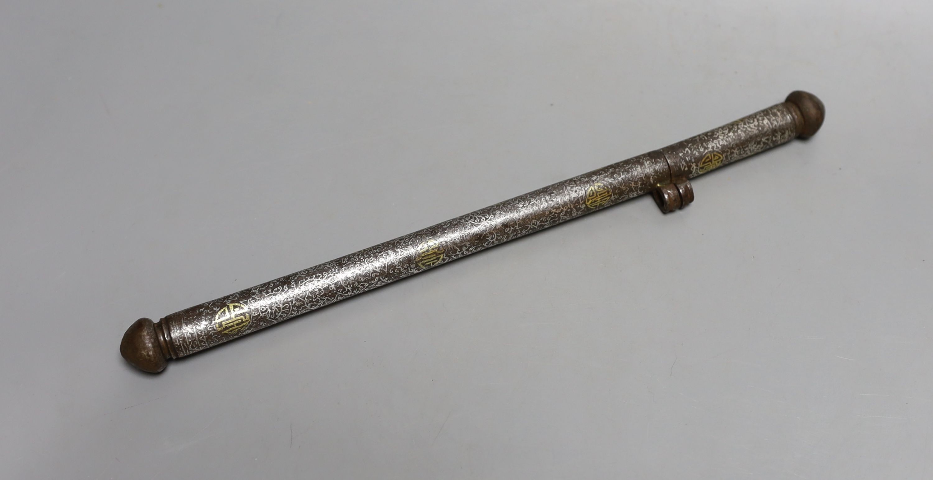 An 18th century Tibetan silver and gold damascened iron pen case, 31.5 cms long.